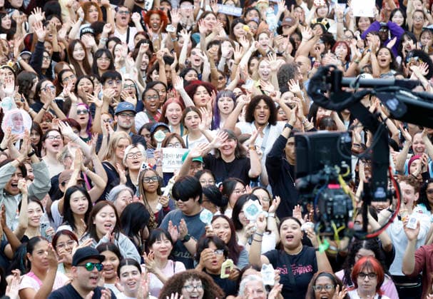 Fans react to the TV Broadcast when South Korean singer and songwriter Yeonjun performs at the Good Morning America 2026 Summer Concert Series at the Rumsey Playfield SummerStage in Central Park in New York City on Wednesday, August 5, 2026.  NYP20260805108 JOHNxANGELILLO