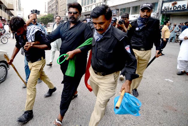 RECORD DATE NOT STATED Police staffs arrest protesters during the protest demonstration of Tehreek-e-Insaf (PTI) for release of PTI Founder Imran Khan, at Fawara Chowk nearby Karachi press club on Wednesday, August 5, 2026. Pakistan Tehreek-e-Insaf (PTI) launched countrywide protests on August 5, 2026, to mark three years of imprisonment of party founder Imran Khan and to demand his immediate release. (S.Imran Ali PPI Images). EDITORIAL USE ONLY Copyright: xx AR-ZM-050826x ppiphotos484820