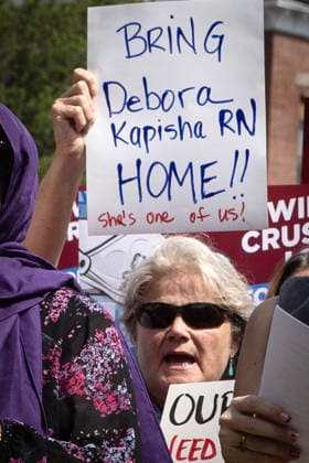 August 5, 2026, Portland, Maine, USA: Members of the Maine State Nurses Association union protest federal Immigration and Customs Enforcement (ICE) on the lawn outside Maine Medical Center, the stateÃ¢â‚¬â ¢s largest hospital, on Wednesday morning, August 5, 2026. Nurses demanded the release of colleague and medical-surgical nurse, DEBORA KAPISHA, who was detained by federal officials at Logan Airport in Boston on July 30, 2026. Union members said KAPISHA, originally from Zambia, has federal authorization to work in Maine while awaiting the outcome of her asylum case. In addition to KAPISHAÃ¢â‚¬â ¢S release, union members demanded their employer, Maine Medical Center, take immediate steps to formally sponsor KAPISHA for permanent residency. - ZUMAb349 20260805_znp_b349_008 Copyright: xTroyxR.xBennettx