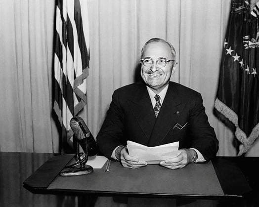 U.S. President Harry S. Truman smiling for photographers while delivering radio speech to the nation concerning the reconversion program for a peacetime economy, White House Oval Office, Washington, D.C., USA, Abbie Rowe, National Parks Service, Harry S. Truman Library, January 3, 1946  Copyright: xCircaxImagesx ghi-circa14394