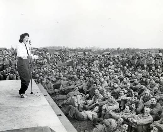 Crowd of GIs flock around an improvised platform to witness first U.S.O. camp show, France, U.S. Army Signal Corps, July 26, 1944  Copyright: xCircaxImagesx ghi-circa14446