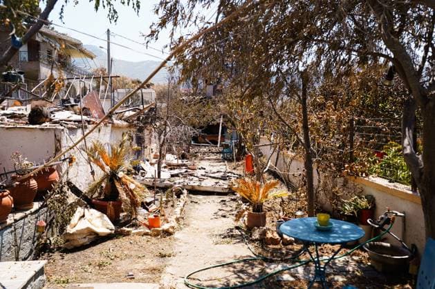Residents return to wildfire-ravaged homes in western Attica PORTO GERMENO, WEST ATTICA, GREECE AUGUST 5, 2026: Extensive destruction caused by a major wildfire is seen in Porto Germeno, western Attica, four days after the fire swept through the area. More than 50 homes sustained damage ranging from partial destruction to complete collapse. Recovery and assessment operations continue as crews clear debris and inspection teams from Greece s General Secretariat for Natural Disaster Recovery evaluate damaged properties. Parts of the area remain without electricity and running water while restoration efforts continue. Porto Germeno Greece Copyright: x xRomanosxLioutasx xJNAxPressx