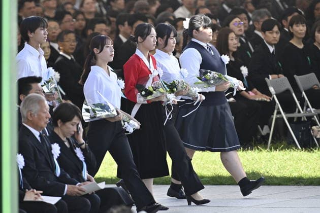 Japan marks 81st anniversary of the atomic bombing of Hiroshima HIROSHIMA, JAPAN - AUGUST 6 : Schoolchildren offer flowers at the cenotaph for atomic bomb victims during the Hiroshima Peace Memorial Ceremony at Peace Memorial Park in Hiroshima, Japan, on August 6, 2026. Japan marks the 81st anniversary of the atomic bombing of Hiroshima. David Mareuil Anadolu Hiroshima Japan. Editorial use only. Please get in touch for any other usage.  Copyright: x2026xAnadoluxDavidxMareuilx