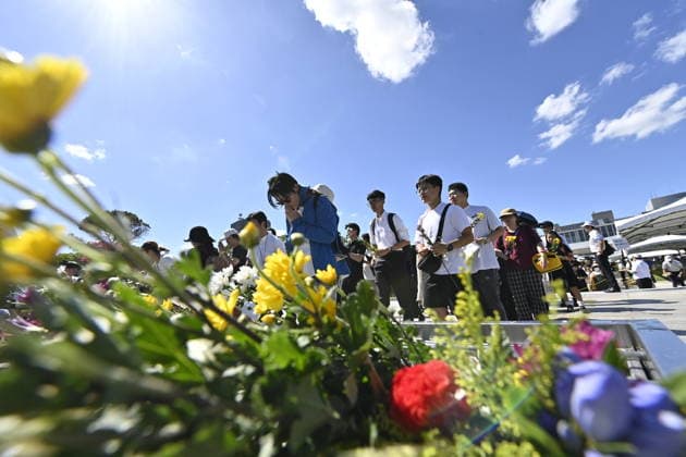 Japan marks 81st anniversary of the atomic bombing of Hiroshima HIROSHIMA, JAPAN - AUGUST 6 : People offer flowers and pray in front of the cenotaph for atomic bomb victims at Peace Memorial Park following the Hiroshima Peace Memorial Ceremony in Hiroshima, Japan, on August 6, 2026. Japan marks the 81st anniversary of the atomic bombing of Hiroshima. David Mareuil Anadolu Hiroshima Japan. Editorial use only. Please get in touch for any other usage.  Copyright: x2026xAnadoluxDavidxMareuilx