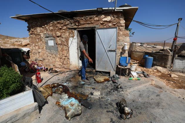 Homes burned, residents injured in Israeli settlers attack on Masafer Yatta community HEBRON, WEST BANK, PALESTINE - AUGUST 6: A Palestinian resident inspects the damage to a home that was set on fire following an attack by Israeli settlers in the Khirbet al-Tuba community in the Masafer Yatta area, south of Hebron, West Bank, Palestine on August 6, 2026. Six Palestinians, including three women, were injured and several homes were set ablaze in the attack. Wisam Hashlamoun Anadolu Hebron West Bank. Editorial use only. Please get in touch for any other usage.  Copyright: x2026xAnadoluxWisamxHashlamounx