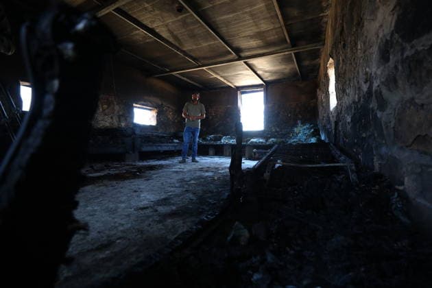 Homes burned, residents injured in Israeli settlers attack on Masafer Yatta community HEBRON, WEST BANK, PALESTINE - AUGUST 6: A Palestinian resident inspects the damage to a home that was set on fire following an attack by Israeli settlers in the Khirbet al-Tuba community in the Masafer Yatta area, south of Hebron, West Bank, Palestine on August 6, 2026. Six Palestinians, including three women, were injured and several homes were set ablaze in the attack. Wisam Hashlamoun Anadolu Hebron West Bank. Editorial use only. Please get in touch for any other usage.  Copyright: x2026xAnadoluxWisamxHashlamounx
