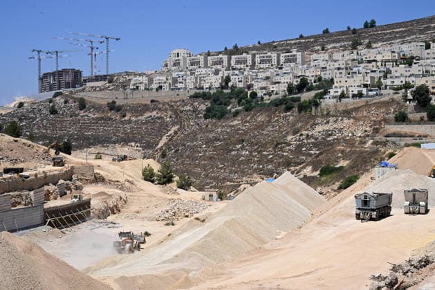 Heavy equipment prepares the ground for the construction of thousands of residential units in the new neighborhood Givat HaShalvah in the Givat Zeev Settlement in the West Bank, near Jerusalem and Ramallah, on Thursday, August 6, 2026.  JER2026080613 DEBBIExHILL