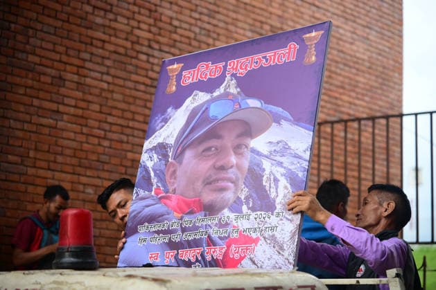 August 6, 2026, Kathmandu, Bagmati, Nepal: Family members, friends, and supporters place a photograph of veteran Nepali mountaineer Pur Bahadur Gurung (Yukta) on the vehicle carrying his body from Tribhuvan International Airport to the cremation site in Kathmandu, Nepal, on August 6, 2026, after it was repatriated from Pakistan following the Broad Peak avalanche tragedy. Gurung, the Vice President of Nepal Mountaineering Association (NMA) Gandaki Province and a member of the Manang School Development Committee, was among the climbers killed in the devastating avalanche on Broad Peak (8,047 m) in Pakistan s Karakoram Range on July 30, 2026. The tragedy also claimed the lives of renowned British-Nepali mountaineer Nirmal Nims Purja, Nima - ZUMAs330 20260806_zsp_s330_012 Copyright: xSafalxPrakashxShresthax