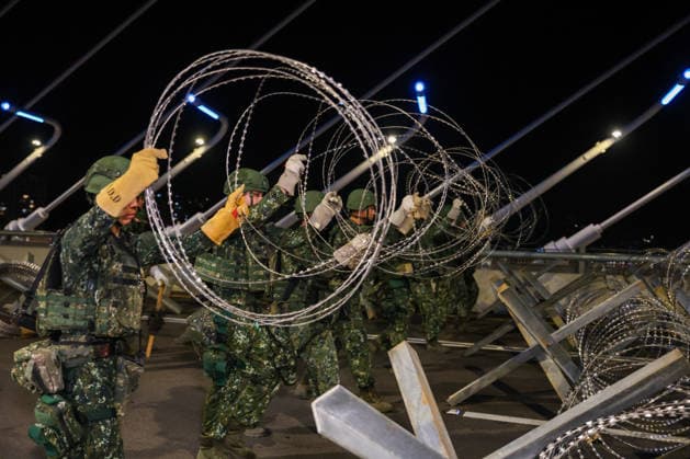 Han Kuang Military Exercise in Taiwan NEW TAIPEI, TAIWAN - AUGUST 6: Taiwanese soldiers set up anti-tank obstacles on the Danjiang (Tamkang) Bridge to simulate stopping Chinese forces from approaching, during an obstacle emplacement operation as part of the Han-Kuang military exercise, in New Taipei City, Taiwan on August 6, 2026. The 10-days long Han-Kuang exercise with unscripted training sessions test the island s defense capabilities in the event of a possible invasion by China, as Beijing has significantly increased its military activities around the Taiwan Strait and the South China Sea. Daniel Ceng Anadolu New Taipei Taiwan. Editorial use only. Please get in touch for any other usage.  Copyright: x2026xAnadoluxDanielxCengx