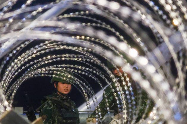 Han Kuang Military Exercise in Taiwan NEW TAIPEI, TAIWAN - AUGUST 6: Taiwanese soldiers set up barbed wires on the Danjiang (Tamkang) Bridge to simulate stopping Chinese forces from approaching, during an obstacle emplacement operation as part of the Han-Kuang military exercise, in New Taipei City, Taiwan on August 6, 2026. The 10-days long Han-Kuang exercise with unscripted training sessions test the island s defense capabilities in the event of a possible invasion by China, as Beijing has significantly increased its military activities around the Taiwan Strait and the South China Sea. Daniel Ceng Anadolu New Taipei Taiwan. Editorial use only. Please get in touch for any other usage.  Copyright: x2026xAnadoluxDanielxCengx
