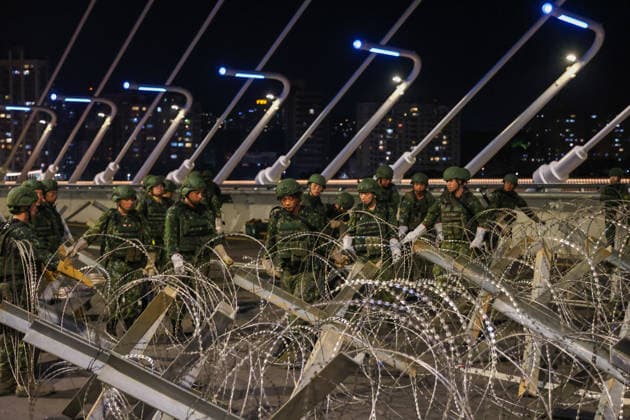 Han Kuang Military Exercise in Taiwan NEW TAIPEI, TAIWAN - AUGUST 6: Taiwanese soldiers set up anti-tank obstacles on the Danjiang (Tamkang) Bridge to simulate stopping Chinese forces from approaching, during an obstacle emplacement operation as part of the Han-Kuang military exercise, in New Taipei City, Taiwan on August 6, 2026. The 10-days long Han-Kuang exercise with unscripted training sessions test the island s defense capabilities in the event of a possible invasion by China, as Beijing has significantly increased its military activities around the Taiwan Strait and the South China Sea. Daniel Ceng Anadolu New Taipei Taiwan. Editorial use only. Please get in touch for any other usage.  Copyright: x2026xAnadoluxDanielxCengx