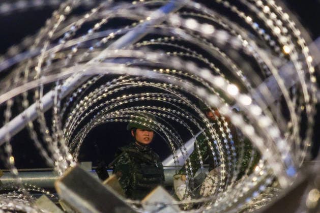 Han Kuang Military Exercise in Taiwan NEW TAIPEI, TAIWAN - AUGUST 6: Taiwanese soldiers set up barbed wires on the Danjiang (Tamkang) Bridge to simulate stopping Chinese forces from approaching, during an obstacle emplacement operation as part of the Han-Kuang military exercise, in New Taipei City, Taiwan on August 6, 2026. The 10-days long Han-Kuang exercise with unscripted training sessions test the island s defense capabilities in the event of a possible invasion by China, as Beijing has significantly increased its military activities around the Taiwan Strait and the South China Sea. Daniel Ceng Anadolu New Taipei Taiwan. Editorial use only. Please get in touch for any other usage.  Copyright: x2026xAnadoluxDanielxCengx