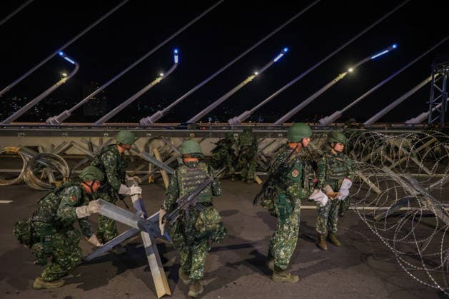 Han Kuang Military Exercise in Taiwan NEW TAIPEI, TAIWAN - AUGUST 6: Taiwanese soldiers set up anti-tank obstacles on the Danjiang (Tamkang) Bridge to simulate stopping Chinese forces from approaching, during an obstacle emplacement operation as part of the Han-Kuang military exercise, in New Taipei City, Taiwan on August 6, 2026. The 10-days long Han-Kuang exercise with unscripted training sessions test the island s defense capabilities in the event of a possible invasion by China, as Beijing has significantly increased its military activities around the Taiwan Strait and the South China Sea. Daniel Ceng Anadolu New Taipei Taiwan. Editorial use only. Please get in touch for any other usage.  Copyright: x2026xAnadoluxDanielxCengx