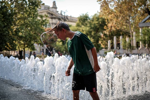 (260806) -- BUDAPEST, Aug. 6, 2026 -- A boy cools off at a fountain in Budapest, Hungary, Aug. 6, 2026. Hungarian authorities on Tuesday extended the country s highest-level heat alert until midnight on Friday as forecasts indicate the ongoing heatwave will continue across the country. (Photo by h Xinhua) HUNGARY-BUDAPEST-HEAT WAVE DavidxBalog 