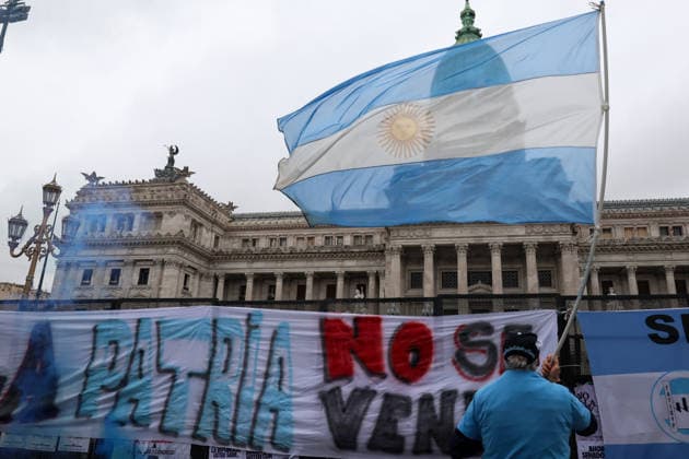 August 6, 2026, Buenos Aires, Buenos Aires, Argentina: Protesters are demonstrating outside the National Congress (Buenos Aires) against the Private Property Inviolability Bill currently being debated in the Senate. The bill includes faster evictions, stricter limits on expropriations, changes to rural land ownership rules, and modifications to environmental regulations. Demonstrators argue that it threatens land rights, environmental protections, and national sovereignty. Buenos Aires Argentina - ZUMAa188 20260806_zip_a188_004 Copyright: xPaulaxAcunzox