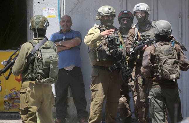 August 6, 2026, Nablus, Palestine: Israeli forces seen raiding shops, during a military operation in neighborhoods of the Askar refugee camp east of Nablus in the West Bank. The raid is part of a broader military campaign targeting refugee camps in the West Bank. The Israeli government has threatened to occupy refugee camps, in areas under the control of Palestinian President Mahmoud Abbas. Nablus Palestine - ZUMAs197 20260806_aaa_s197_104 Copyright: xNasserxishatyehx