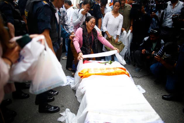 August 6, 2026, Kathmandu, Nepal: Relatives mourn over the coffin containing the body of renowned Nepali mountaineer Pur Bahadur Gurung (Yukta) at Tribhuvan International Airport. Gurung, Vice President of the Nepal Mountaineering Association, Gandaki Province, was among the climbers killed in an avalanche on Broad Peak in Pakistan and was the first victim to be recovered from the avalanche site. Kathmandu Nepal  - ZUMAhe B 20260806_mda_g200_159 Copyright: xSkandaxGautamx