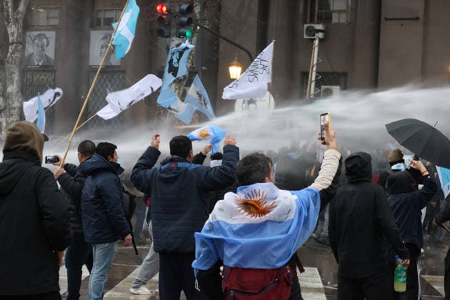 August 6, 2026, Buenos Aires, Buenos Aires, Argentina: Protesters are demonstrating outside the National Congress (Buenos Aires) against the Private Property Inviolability Bill currently being debated in the Senate. The bill includes faster evictions, stricter limits on expropriations, changes to rural land ownership rules, and modifications to environmental regulations. Demonstrators argue that it threatens land rights, environmental protections, and national sovereignty. Buenos Aires Argentina - ZUMAa188 20260806_zip_a188_038 Copyright: xPaulaxAcunzox