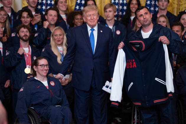 President Trump Hosts Team USA Olympians at White House United States President Donald J Trump poses for a photo with U.S. Olympic athletes in the East Room of the White House in Washington, DC, USA, on Thursday, August 6, 2026. President Trump is hosting a ceremony for Team USA Olympians who competed in the 2026 Olympic Winter Games in Italy. Credit: Aaron Schwartz Pool via CNP Washington District of Columbia United States  Copyright: xPool ABACAx