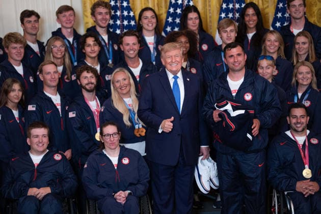 President Trump Hosts Team USA Olympians at White House United States President Donald J Trump poses for a photo with U.S. Olympic athletes in the East Room of the White House in Washington, DC, USA, on Thursday, August 6, 2026. President Trump is hosting a ceremony for Team USA Olympians who competed in the 2026 Olympic Winter Games in Italy. Credit: Aaron Schwartz Pool via CNP Washington District of Columbia United States  Copyright: xPool ABACAx