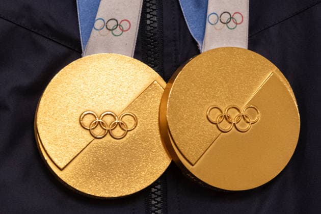 August 6, 2026, Washington, District Of Columbia, United States: Olympic medals hang from Team USA athletes during a White House event with President DONALD TRUMP honoring Olympians and Paralympians following the 2026 Milano Cortina Winter Olympic and Paralympic Games. Washington United States - ZUMAk206 20260806_znp_k206_021 Copyright: xMattxKaminskyx