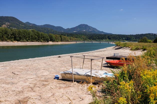 August 6, 2026, Vrhovo, Slovenia: Boats are seen stranded in a partially dry riverbed of Sava river near Vrhovo hydro power plant. Slovenia faces record low water levels due to longlasting drought and a recent heatwave, causing the KrÅ¡ko Nuclear Power Plant to reduce power and a temporary suspension of fishing on several rivers. Vrhovo Slovenia - ZUMAs197 20260806_aaa_s197_206 Copyright: xLukaxDakskoblerx
