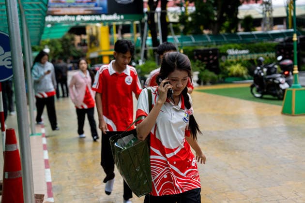 (260807) -- NONTHABURI, Aug. 7, 2026 -- Students are evacuated from the site of a school shooting in Nonthaburi Province, Thailand, on Aug. 7, 2026. A school shooting occurred Friday morning in Nonthaburi Province, Thailand, leaving at least 7 people dead and 15 injured, Thai media reported. The deceased include three teachers, three students, and the gunman, according to the province s disaster prevention and mitigation office. (SpotNews)THAILAND-NONTHABURI-SHOOTING-DEATH TOLL SunxWeitong 