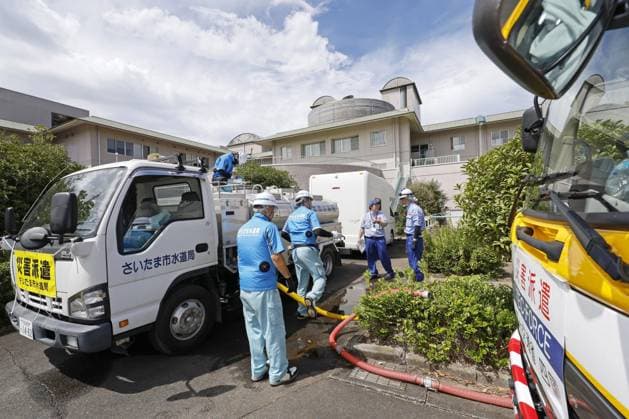 Aftermath of strong earthquake in Kumamoto Workers dispatched from the waterworks department of Saitama Prefecture in eastern Japan provide water to residents at a nursing home in Uto, Kumamoto Prefecture, on Aug. 7, 2026, after a powerful earthquake struck the southwestern Japan prefecture on July 28.  A14AA0005625327P