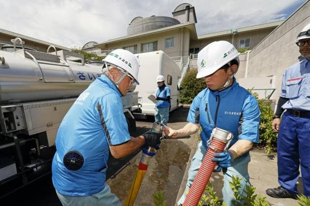 Aftermath of strong earthquake in Kumamoto Workers dispatched from the waterworks department of Saitama Prefecture in eastern Japan provide water to residents at a nursing home in Uto, Kumamoto Prefecture, on Aug. 7, 2026, after a powerful earthquake struck the southwestern Japan prefecture on July 28.  A14AA0005625328P