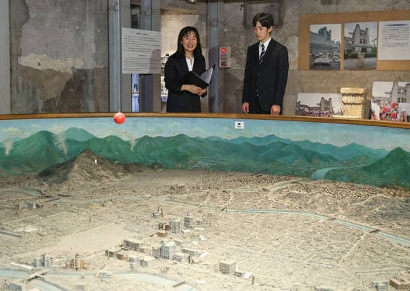 Japan Prince Hisahito visits A-bomb-hit school in Hiroshima Japanese Prince Hisahito visits a peace museum built at an elementary school in Hiroshima that survived the 1945 U.S. atomic bombing on Aug. 7, 2026, a day after the 81st anniversary of the attack on the western Japan city. The blast left about 400 students dead at the school. (Pool photo)  A14AA0005625343P