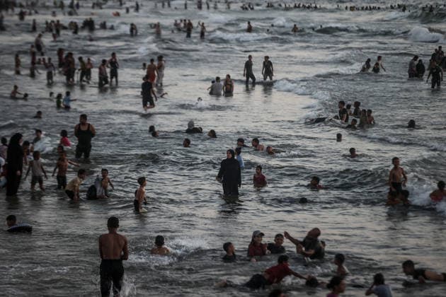 Daily life in Gaza GAZA CITY, GAZA, PALESTINE - AUGUST 7: Palestinians gather along the beach in Gaza City to cool off and seek relief from soaring summer temperatures and severe living conditions stemming from ongoing Israeli attacks on Gaza, Palestine on August 7, 2026. Palestinian families spend time swimming in the sea and strolling along the shore to find a brief respite from the crisis Ali Jadallah Anadolu Gaza City Gaza. Editorial use only. Please get in touch for any other usage.  Copyright: x2026xAnadoluxAlixJadallahx
