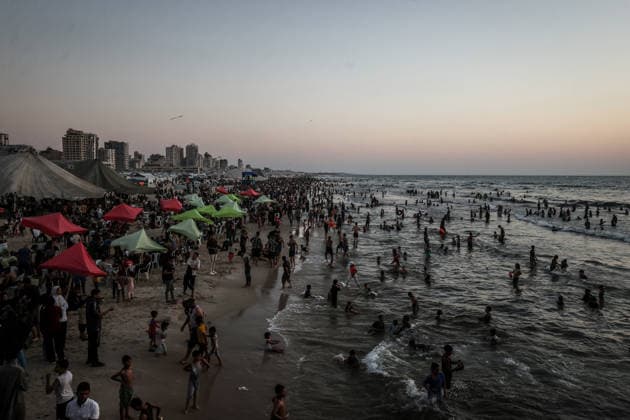 Daily life in Gaza GAZA CITY, GAZA, PALESTINE - AUGUST 7: Palestinians gather along the beach in Gaza City to cool off and seek relief from soaring summer temperatures and severe living conditions stemming from ongoing Israeli attacks on Gaza, Palestine on August 7, 2026. Palestinian families spend time swimming in the sea and strolling along the shore to find a brief respite from the crisis Ali Jadallah Anadolu Gaza City Gaza. Editorial use only. Please get in touch for any other usage.  Copyright: x2026xAnadoluxAlixJadallahx