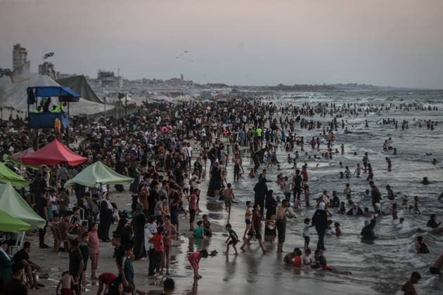 Daily life in Gaza GAZA CITY, GAZA, PALESTINE - AUGUST 7: Palestinians gather along the beach in Gaza City to cool off and seek relief from soaring summer temperatures and severe living conditions stemming from ongoing Israeli attacks on Gaza, Palestine on August 7, 2026. Palestinian families spend time swimming in the sea and strolling along the shore to find a brief respite from the crisis Ali Jadallah Anadolu Gaza City Gaza. Editorial use only. Please get in touch for any other usage.  Copyright: x2026xAnadoluxAlixJadallahx