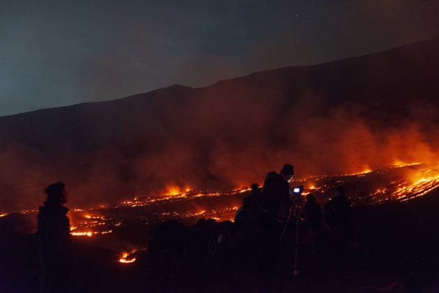 Volcanic activity intensifies at Mount Etna CATANIA, ITALY - AUGUST 8: Mount Etna enters a new paroxysmal phase characterized by intense activity at the Voragine summit crater in Catania, Sicily, Italy on August 8, 2026. The volcanic activity, which began to rapidly intensify during the evening of August 6, evolved into a powerful lava fountain overnight and into August 7. The eruption generated a significant ash cloud dispersing towards the southeast, with ashfall reported in the surrounding towns of Ragalna and Adrano. Additionally, a new lava flow was observed in the Valle del Leone from a new eruptive vent opened at an altitude of approximately 2750. The presence of volcanic ash and the elevation of the aviation alert to red severely im  Copyright: x2026xAnadoluxSalvatorexAllegrax
