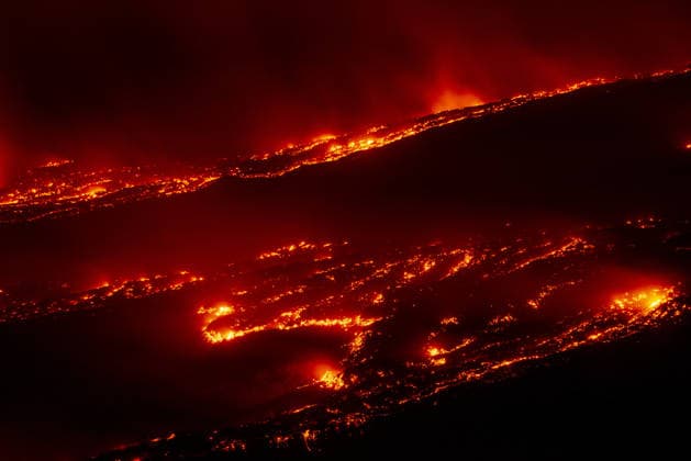 Volcanic activity intensifies at Mount Etna CATANIA, ITALY - AUGUST 8: Mount Etna enters a new paroxysmal phase characterized by intense activity at the Voragine summit crater in Catania, Sicily, Italy on August 8, 2026. The volcanic activity, which began to rapidly intensify during the evening of August 6, evolved into a powerful lava fountain overnight and into August 7. The eruption generated a significant ash cloud dispersing towards the southeast, with ashfall reported in the surrounding towns of Ragalna and Adrano. Additionally, a new lava flow was observed in the Valle del Leone from a new eruptive vent opened at an altitude of approximately 2750. The presence of volcanic ash and the elevation of the aviation alert to red severely im  Copyright: x2026xAnadoluxSalvatorexAllegrax