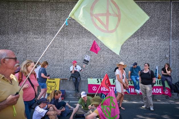 THE HAGUE - Climate protesters from Extinction Rebellion during a blockade of the A12 motorway. In a statement, XR reports that the blockade is a response to the persistent Dutch drought and the apocalyptic wildfires in France, Spain, and Limburg . PHIL NIJHUIS ANP netherlands out - belgium out  Copyright: xx x565076216x originalFilename: 565076216.jpg