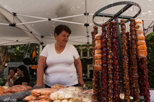 ARMENIA, YEREVAN - AUGUST 8, 2026: A woman keeps a confectionery stall during the Siroooon Arm Fest festival celebrating the culture of Armenia in Seasons Park, central Yerevan. Alexander Patrin TASS  95905832