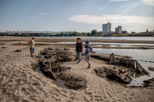 Remains of an old World War II-era ship in Hungary BAJA, HUNGARY – AUGUST 8: People gather along the exposed riverbed of the Danube, after exceptionally low water levels revealed the remains of an old World War II-era ship from the riverbed in Baja, Hungary on August 8, 2026. The emergence of the wreck has attracted hundreds of curious visitors to the site. Robert Nemeti Anadolu Baja Hungary. Editorial use only. Please get in touch for any other usage.  Copyright: x2026xAnadoluxRobertxNemetix