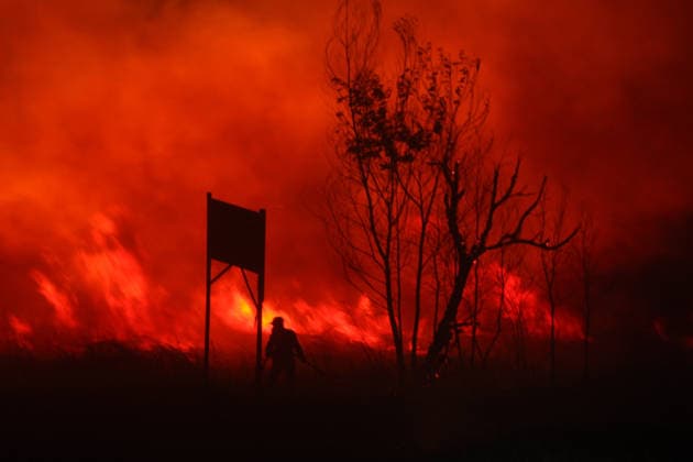 Firefighters battle forest fire in Indonesia s South Sumatra Province SOUTH SUMATRA, INDONESIA - AUGUST 8: Firefighters carry out operations to extinguish a forest fire in a wooded area of South Sumatra province, Indonesia on August 8, 2026. Efforts to control and suppress the blaze remain ongoing as emergency response teams work non-stop to contain the spread. Muhammad Fajri Anadolu South Sumatra Indonesia. Editorial use only. Please get in touch for any other usage.  Copyright: x2026xAnadoluxMuhammadxFajrix