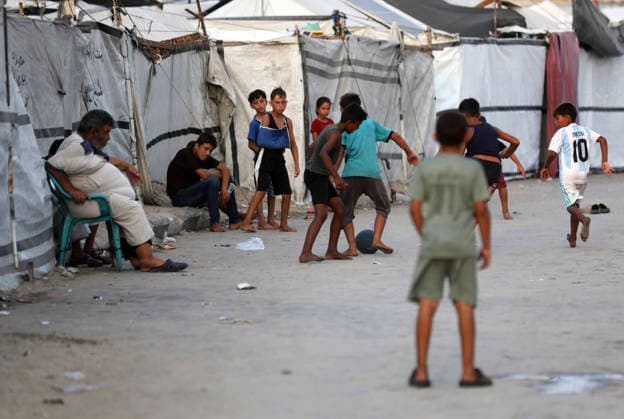 Palestinian children play near displacement tents on Gaza City beach Palestinian children play near tents sheltering displaced families on the beach in Gaza City, on August 7, 2026. The children continue their daily activities amid displacement and difficult living conditions caused by the war. Photo by Bilal Osama apaimages Gaza city Gaza Strip Palestinian Territory 080826_Gaza_BO_03(29) Copyright: xapaimagesxBilalxOsamax xapaimagesx