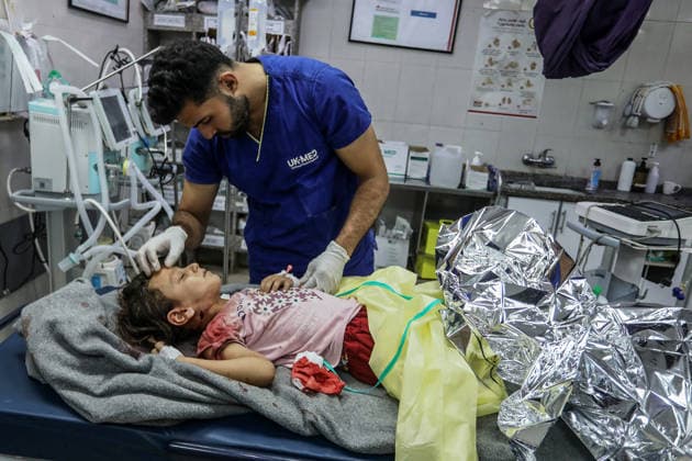 Nine Palestinians were injured by fire from the Israeli army in Gaza KHAN YUNIS, GAZA, PALESTINE - AUGUST 08: (EDITORS NOTE: Image depicts graphic content) Thirteen-year-old Saba al-Hashash, injured in the neck by Israeli fire, receives emergency medical treatment at Nasser Hospital in Khan Yunis, southern Gaza Strip, Palestine on August 08, 2026. At least nine Palestinians, including four children, were injured after Israeli forces opened fire on civilians in the area. Abed Rahim Khatib Anadolu Khan Yunis Gaza. Editorial use only. Please get in touch for any other usage.  Copyright: x2026xAnadoluxAbedxRahimxKhatibx