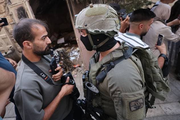 August 8, 2026, Hebron, Palestine, State of: HEBRON, Palestine Ã¢â‚¬ August 8, 2026: A Palestinian family sits inside their vehicle after it was stopped during a settler incursion in the Old City of Hebron, as Israeli forces secure the area. The incident occurred amid heightened tensions and increased settler activity in the historic city. Hebron Palestine, State of  - ZUMAq101 20260808_zna_q101_083 Copyright: xMosabxShawerx