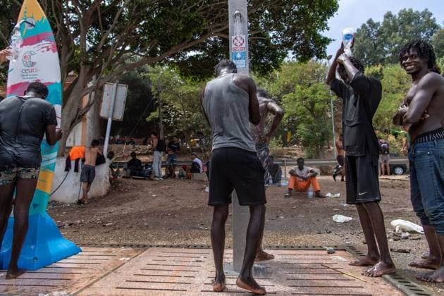 August 8, 2026, Ceuta, Spain: CEUTA, Spain Ã¢â‚¬ August 8, 2026: Migrants who entered the Spanish North African enclave of Ceuta following the mass arrival on July 30 continue to sleep in makeshift camps across the city. Humanitarian organisations distribute food and essential supplies at the two main gathering points where many migrants are staying, while local residents provide shelter to others, including unaccompanied girls and families. Ceuta Spain - ZUMAq101 20260808_zna_q101_195 Copyright: xAntonioxSemperex