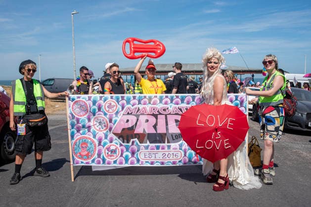 August 8, 2026, Margate, United Kingdom: A transgender artist poses with an umbrella front of the banner of the Margate Pride. Gays, trans and non-binary people gathered in Margate, UK to celebrate the 10th Margate Pride. The crowd paraded from the East side of the town to the town centre. Margate United Kingdom - ZUMAs197 20260808_aaa_s197_167 Copyright: xKrisztianxElekx