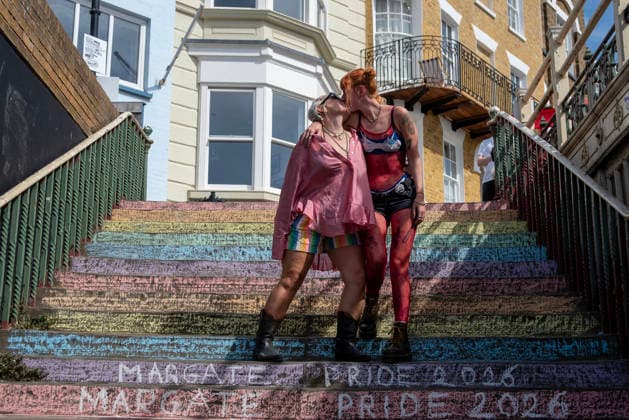 August 8, 2026, Margate, United Kingdom: A couple kisses on the stairs during the Margate Pride. Gays, trans and non-binary people gathered in Margate, UK to celebrate the 10th Margate Pride. The crowd paraded from the East side of the town to the town centre. Margate United Kingdom - ZUMAs197 20260808_aaa_s197_169 Copyright: xKrisztianxElekx