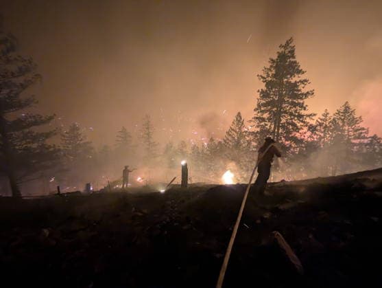 (260809) -- OTTAWA, Aug. 9, 2026 -- This photo provided by the BC Wildfire Service on Aug. 8, 2026 shows firefighters putting out a wildfire near Okanagan Valley in the Southern Interior of British Columbia, Canada. The western Canadian province of British Columbia (B.C.) declared a provincial state of emergency on Saturday as fast-spreading wildfires threatened several communities. (BC Wildfire Service Handout via Xinhua) CANADA-BRITISH COLUMBIA-WILDFIRE LinxWei 