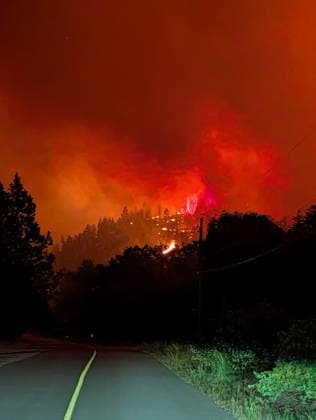 (260809) -- OTTAWA, Aug. 9, 2026 -- This photo provided by the BC Wildfire Service on Aug. 7, 2026 shows a wildfire on a roadside near Okanagan Valley in the Southern Interior of British Columbia, Canada. The western Canadian province of British Columbia (B.C.) declared a provincial state of emergency on Saturday as fast-spreading wildfires threatened several communities. (BC Wildfire Service Handout via Xinhua) CANADA-BRITISH COLUMBIA-WILDFIRE LinxWei 