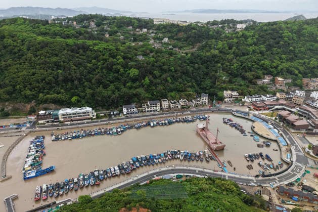 WENZHOU, CHINA - AUGUST 08: Aerial view of boats taking shelter from the upcoming Typhoon Dolphin at a fishing port on August 8, 2026 in Wenzhou, Zhejiang Province of China. Typhoon Dolphin was moving northwestward at a speed of 10 to 15 kilometers per hour and is expected to make landfall along the coast between Zhoushan in Zhejiang Province and Fuding in Fujian Province from the night of August 9 to the morning of August 10.  Copyright: xChinaxNewsxServicex 111658827598