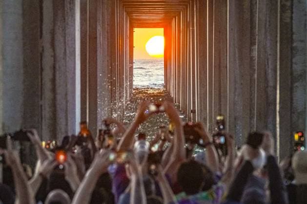 August 8, 2026, San Diego, California, United States: People gather at Scripps Pier to photograph Scrippshenge on Saturday, August 8, 2026, in San Diego, California. San Diego United States - ZUMAs197 20260808_aaa_s197_212 Copyright: xWaixLeexMichaelxHox