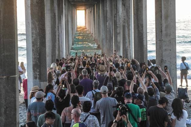 August 8, 2026, San Diego, California, United States: People gather at Scripps Pier to photograph Scrippshenge on Saturday, August 8, 2026, in San Diego, California. San Diego United States - ZUMAs197 20260808_aaa_s197_214 Copyright: xWaixLeexMichaelxHox